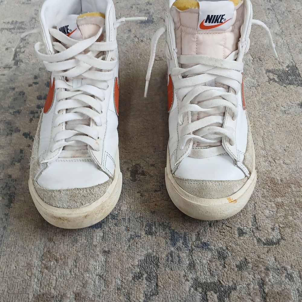 Nike White High-Top Sneakers with Orange Swoosh